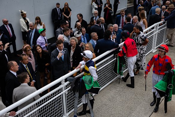 Competitors talk to media after the 2000m race earlier in the day.