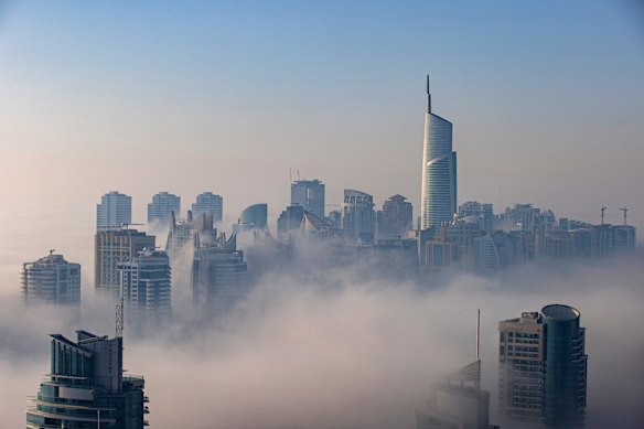 Fog shrouds skyscrapers in the Dubai Marina district of Dubai.