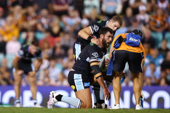 Toby Rudolf is assessed after an injury at Leichhardt Oval.