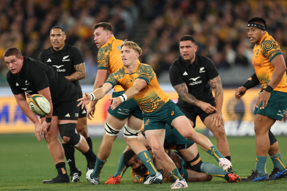 Tate McDermott gets a pass away against the All Blacks.