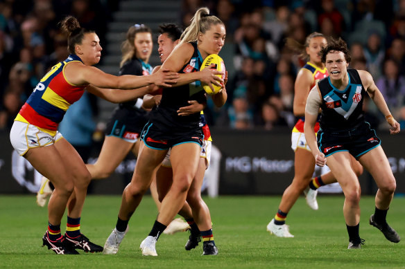 Crows superstar Ebony Marinoff tackles Port Adelaide’s Hannah Dunn in the first AFLW Showdown.
