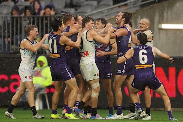 A melee during the 2025 AFL Round 11 match between Walyalup (Fremantle Dockers) and Yartapuulti (Port Adelaide Power) at Optus Stadium on Saturday.