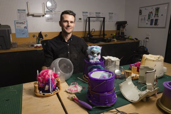 Carl Budd with the crystal ball and an early version of the cauldron in the engineering workshop at Moose Toys’ global headquarters in Melbourne. 