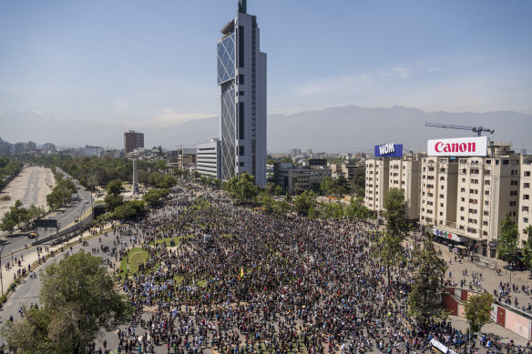 Demonstrators are seen in an aerial photograph taken above Plaza Italia during a protest in Santiago.