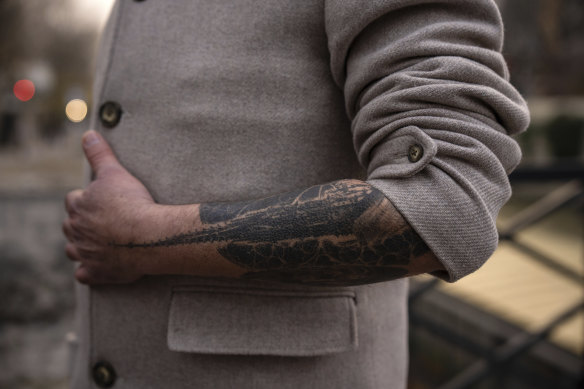 Dedication: Chief architect Philippe Villeneuve shows his tattoo featuring the Notre-Dame de Paris cathedral spire.