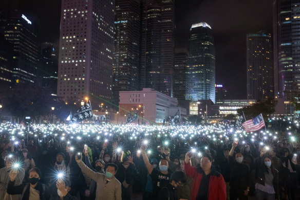 Demonstrators light the night with their smartphones in support of the Spark Alliance at Edinburgh Place, Hong Kong, on Monday.