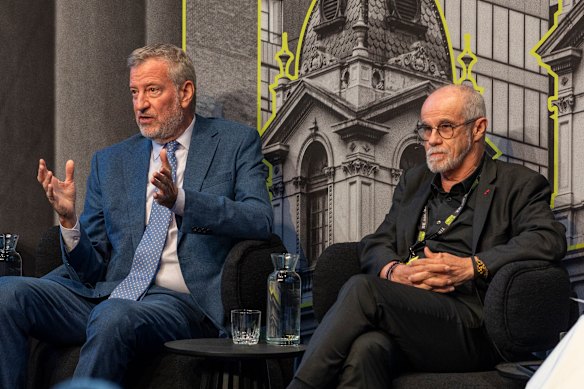 Former New York City mayor Bill de Blasio (left) speaks at Melbourne Assembly alongside Carlos Moreno last night.