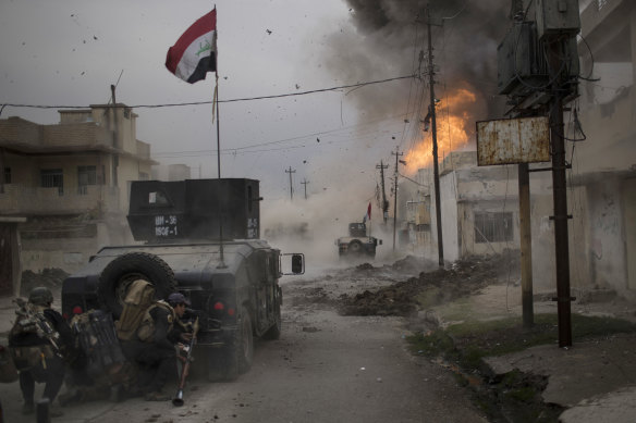 A car bomb explodes in Mosul in 2016