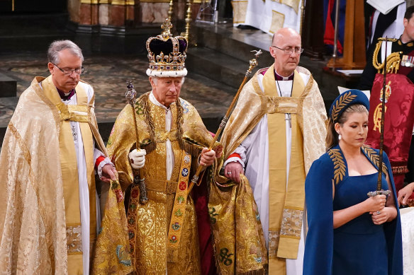 Penny Mordaunt leads King Charles III during his coronation ceremony in May.