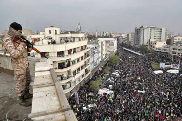 A soldier stands guard overlooking a rally in Tehran last month.