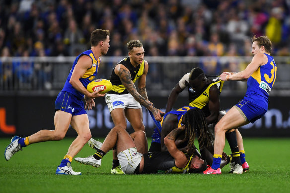 West Coast and Richmond players scrap during the third term.