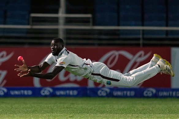 Anderson Phillip takes a catch to dismiss Travis Head.