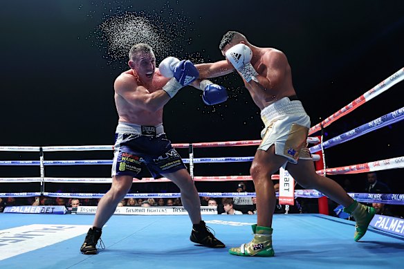 Former NRL footballer Paul Gallen takes more punishment from heavyweight Justis Huni in their 2021 bout.