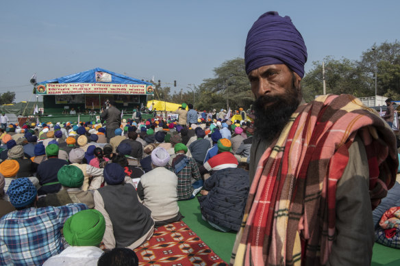A man participates in a farmers protest in Singhu, bordering Delhi, India. Farmers are demanding the repeal of efforts to liberalide the agriculture market. 