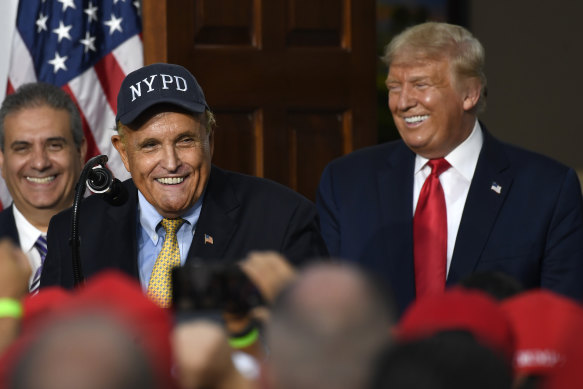 Rudy Giuliani, pictured with Donald Trump in 2020, has had his law licence suspended in New York.