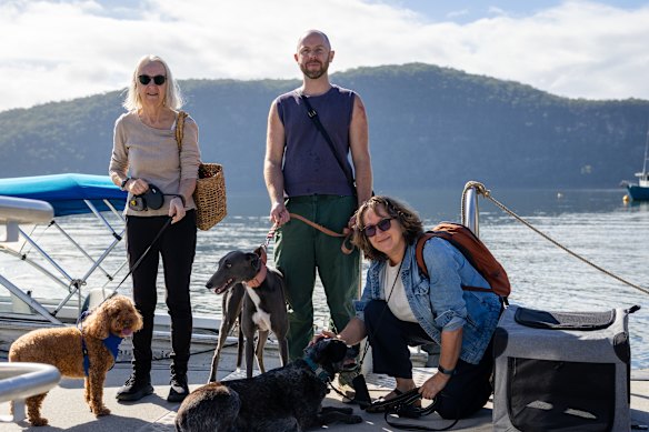 Janel Pratt and Ben Martin, with Lynne McCarthy, and her Australian Kelpie, Azul, at the Dangar Island Terminal.