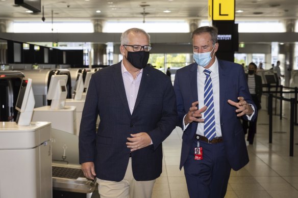 Prime Minister Scott Morrison and Melbourne Airport CEO Lyell Strambi at Melbourne Airport on Sunday.