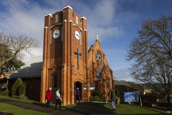 People arrive at the Anglican Church of Saint Paul on Sunday. 