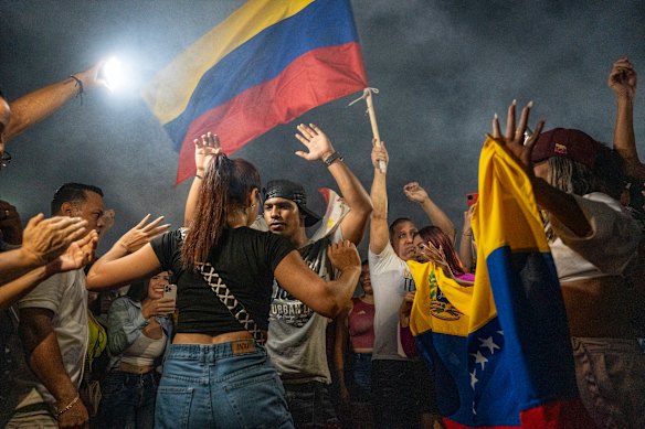 Venezuelan citizens dance during a rally on the Colombia-Venezuela border after the confirmation of Nicolás Maduro’s capture in Caracas. 