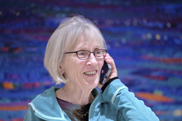 Claudia Goldin speaks to a reporter on the phone in her home after learning that she received the Nobel Prize in Economics.