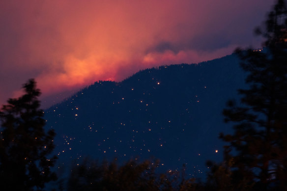 A wildfire burns above the Fraser River Valley near Lytton, British Columbia, Canada, on Friday, July 2, 2021.