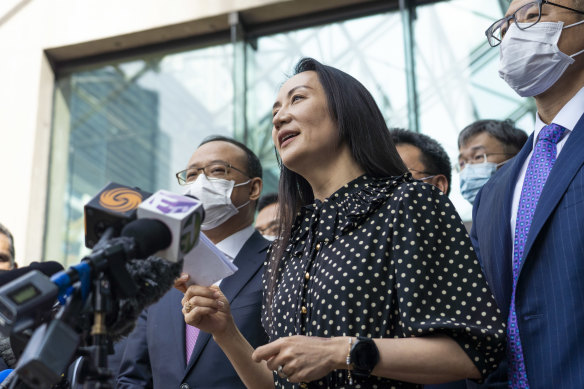 “Over the last three years my life has been turned upside down”: Meng Wanzhou reads a statement  outside the court in Vancouver. 