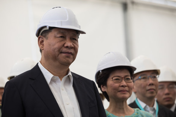 Xi Jinping and Carrie Lam visit a section of the Hong Kong-Zhuhai-Macau bridge in Hong Kong on July 1, 2017. 