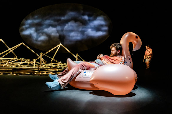 Scott Price takes it easy in his inflatable flamingo.