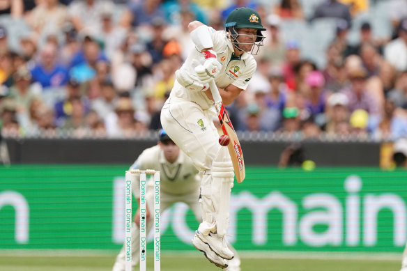 David Warner jumps as he faces a short delivery from New Zealand on Boxing Day.