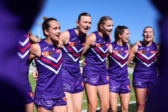 Fremantle belt out their club song after a dominant showing against Richmond.
