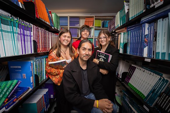 David Glenny with his children Celeste, Addicus and Uraia. The family from Maribyrnong were hit hard by the financial burden of sending the children back to school this week.