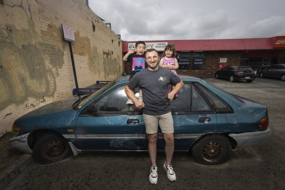 Shaun Borg with the car owned by his grandfather Frank, and his children, Frank and Penelope.