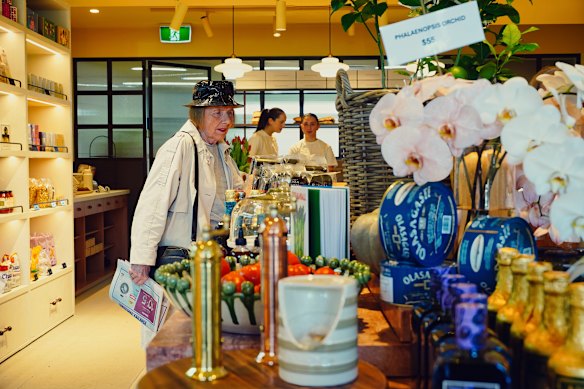 A customer and staff at Breadcetera.