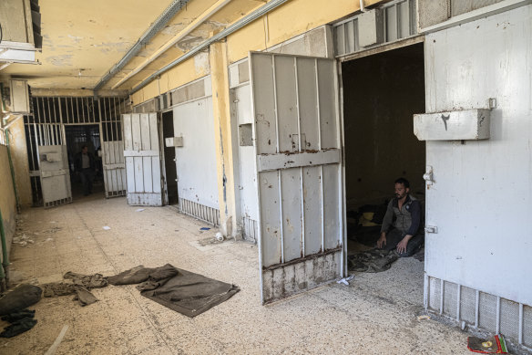A man prays in a cell at Sednaya .