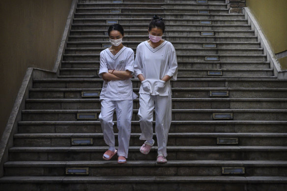 Women on a break at a shopping mall in Beijing.