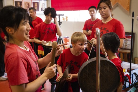 Amber Lee (left) training with other members of the Chinese Masonic Society Lion Dance Team. 