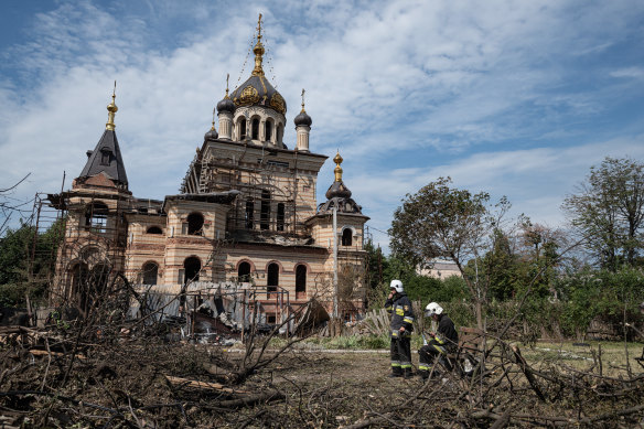 Rescuers take a break after clearing away debris of a heavily damaged building in Vinnytsia last week.