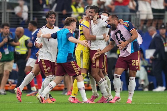 Spain players celebrate after the World Cup semifinal match against France in Arlington, Texas.