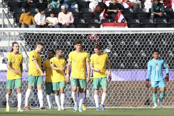 The Socceroos after their second goal.