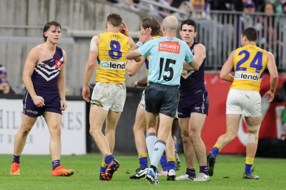 Caleb Serong of the Dockers can be seen with a ripped jersey during the derby.
