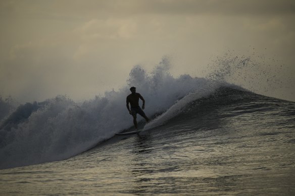 Tahitian-born surfer Kauli Vaast rides a wave in Teahupo’o, Tahiti, French Polynesia.