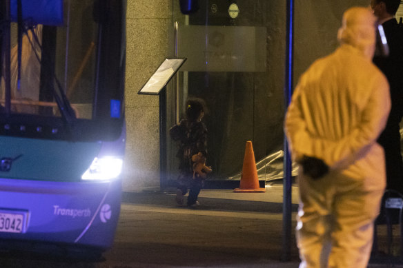 A young girl from Afghanistan holding a stuffed animal arrives in hotel quarantine at the Hyatt Hotel on August 20, 2021 in Perth.