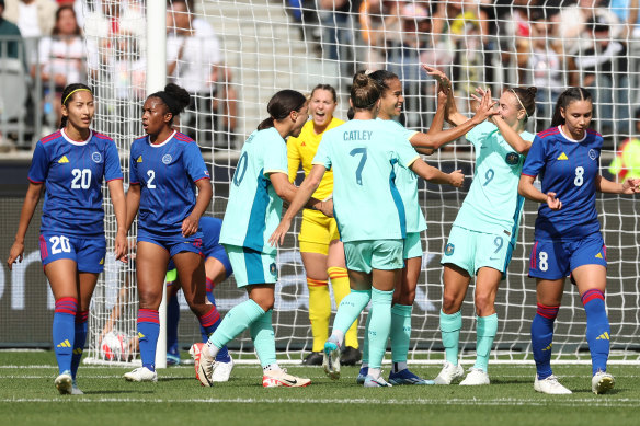 The Matildas celebrate after Mary Fowler scores the opening goal.