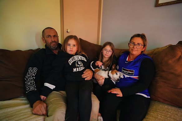Kate Duncan and partner Simon Brooks and their daughters are frustrated by the lack of free-to-air footy on Saturdays. 