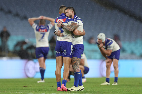 Bronson Xerri and Jacob Kiraz hug after the Bulldogs victory over the Roosters.