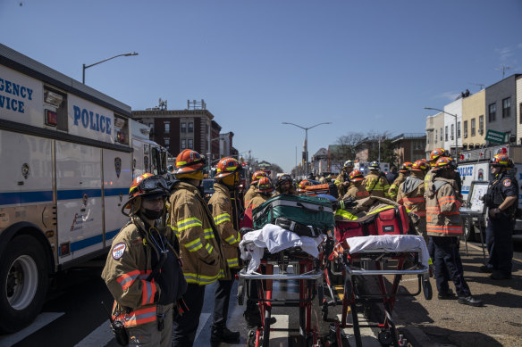 New York City firefighters at the scene of a shooting at the 36th Street subway station on Tuesday.