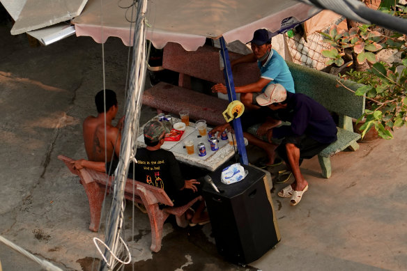 With a portable speaker in tow, locals assemble for karaoke in Ho Chi Minh City on Sunday.