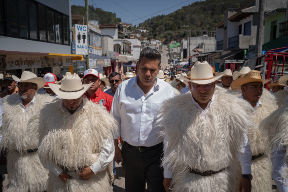 Senatorial candidate Willy Ochoa walks with other PRI candidates before beginning his rally in San Juan Chamula, Mexico.