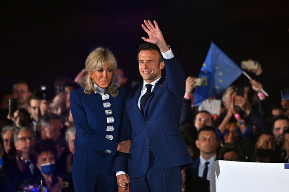 Tough job ahead. Emmanuelle Macron and wife Brigitte celebrate Sunday’s win.