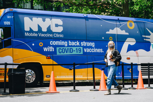 A pedestrian walks by a mobile Covid-19 vaccine clinic at Brighton Beach, Brooklyn, New York.
